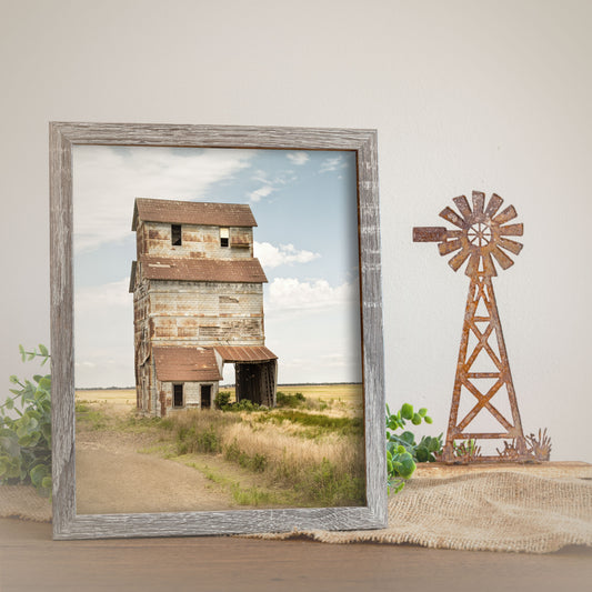 A rustic print featuring the historical Ardell grain elevator amidst a rural landscape.