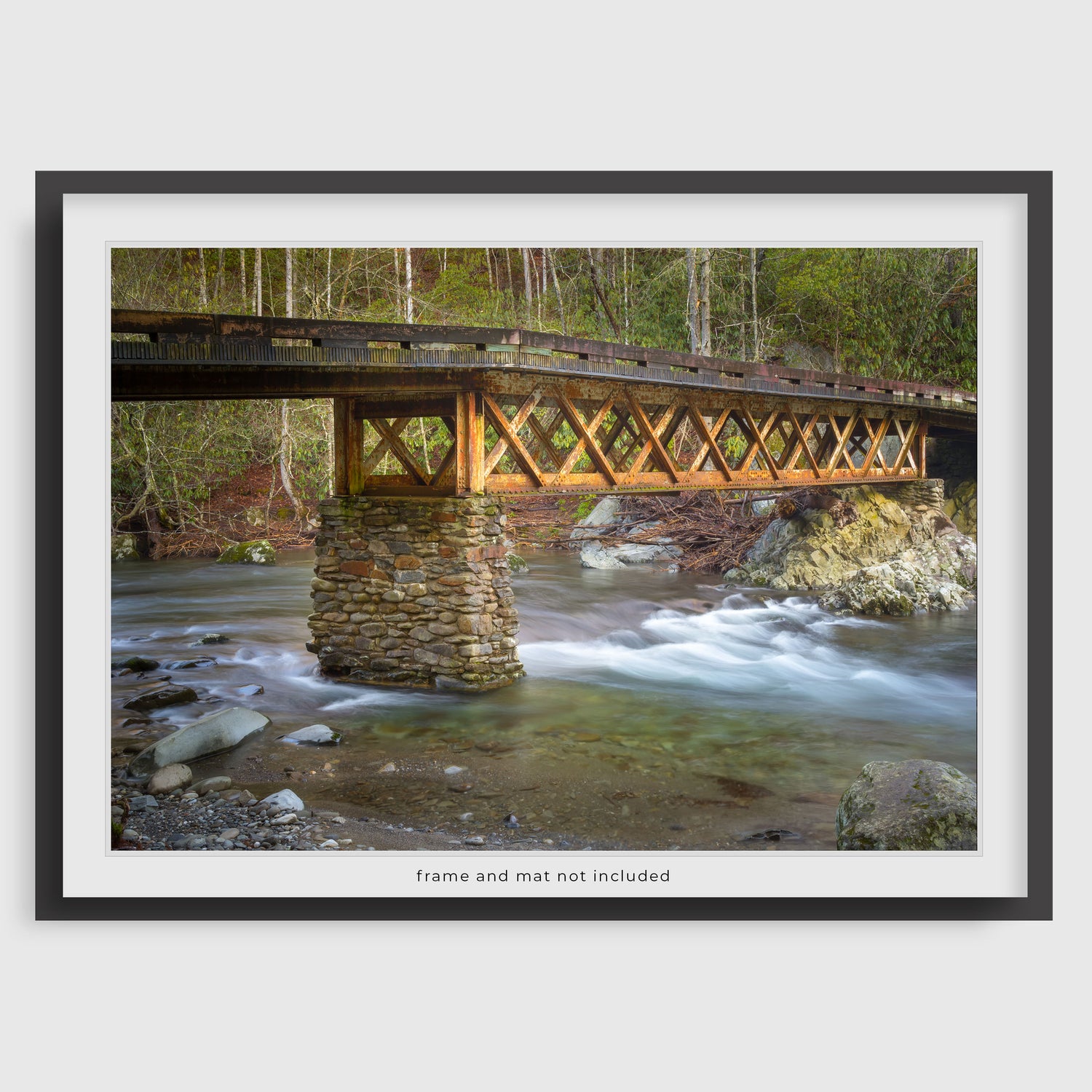 Image displaying a rustic bridge wall art print within a thin black frame and white mat, meant to inspire potential display options. The actual product is the print only; the frame and mat are not included with purchase.