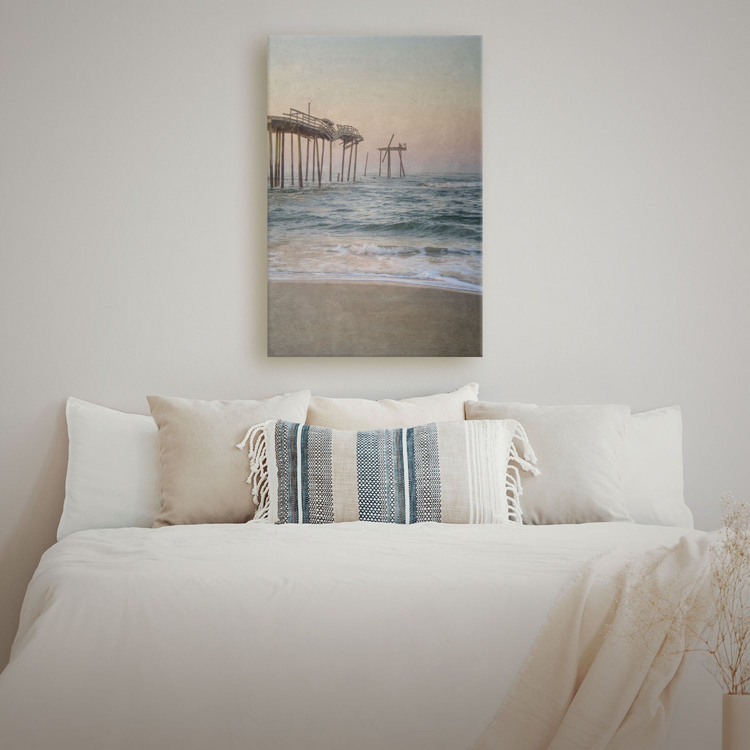 A captivating Frisco Pier Vintage Canvas showcasing the iconic Outer Banks landmark in North Carolina. The canvas features a textured, weathered aesthetic, adding depth and character to the artwork. Soft pastel hues depict a serene sunset, creating a tranquil atmosphere.