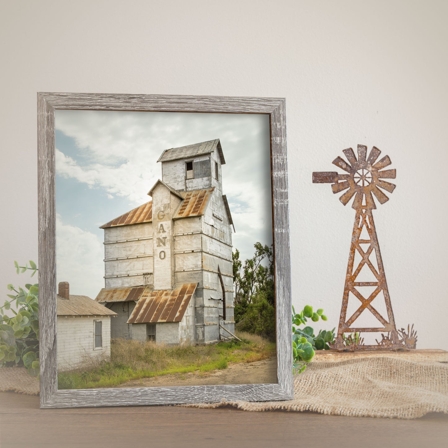 Rustic farmhouse wall art print showcasing the architectural details of the Gano Grain Elevator in Kansas, depicted in a tranquil rural setting