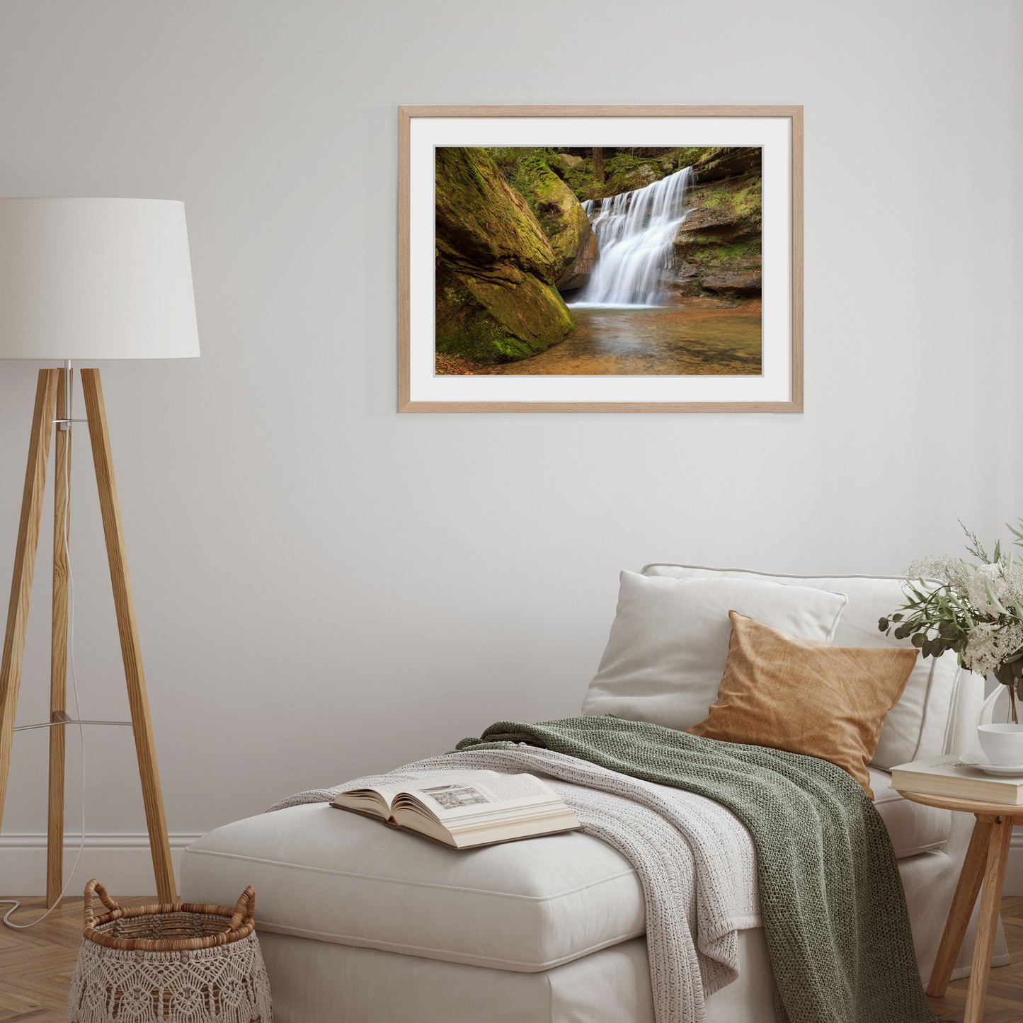 Hocking Hills, Ohio, comes to life in this striking piece of wall art, depicting the peaceful harmony of a waterfall as it flows over textured rocks surrounded by nature's embrace.