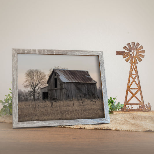 Morning Glory Barn print showcases a rustic barn under the soft morning light, set against a vast, open sky, embodying the serene and simplistic beauty of rural life.