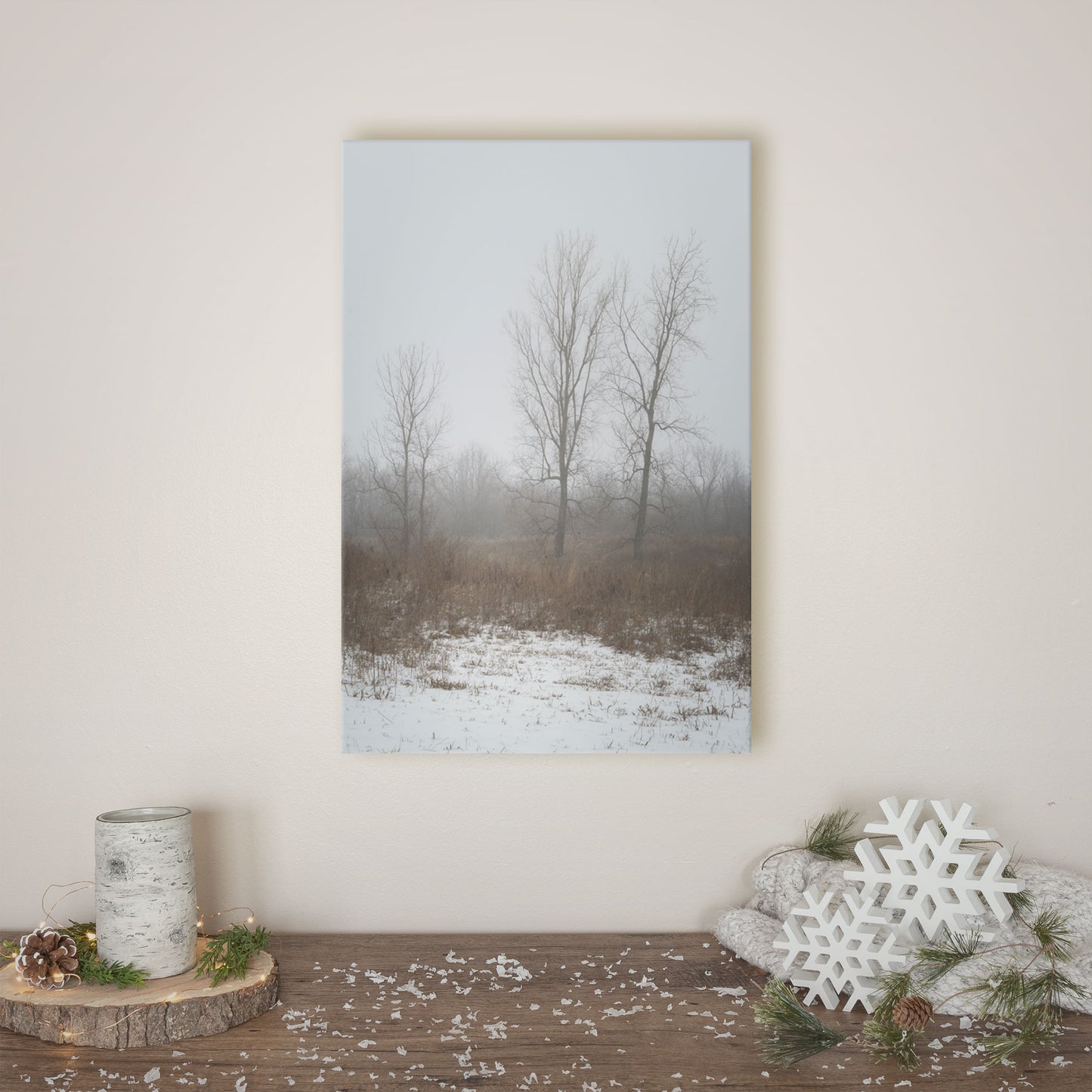 High-quality canvas print featuring snowy, mist-enshrouded trees, ideal for instilling a sense of winter serenity."