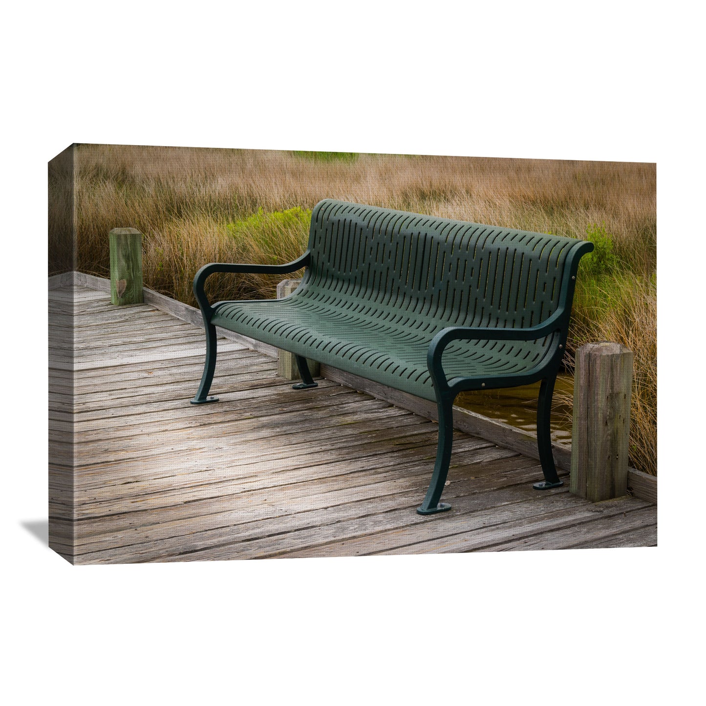 Our canvas artwork focuses on a classic iron bench along the coast, enveloped by the subtle movement of seagrasses in the sea breeze.