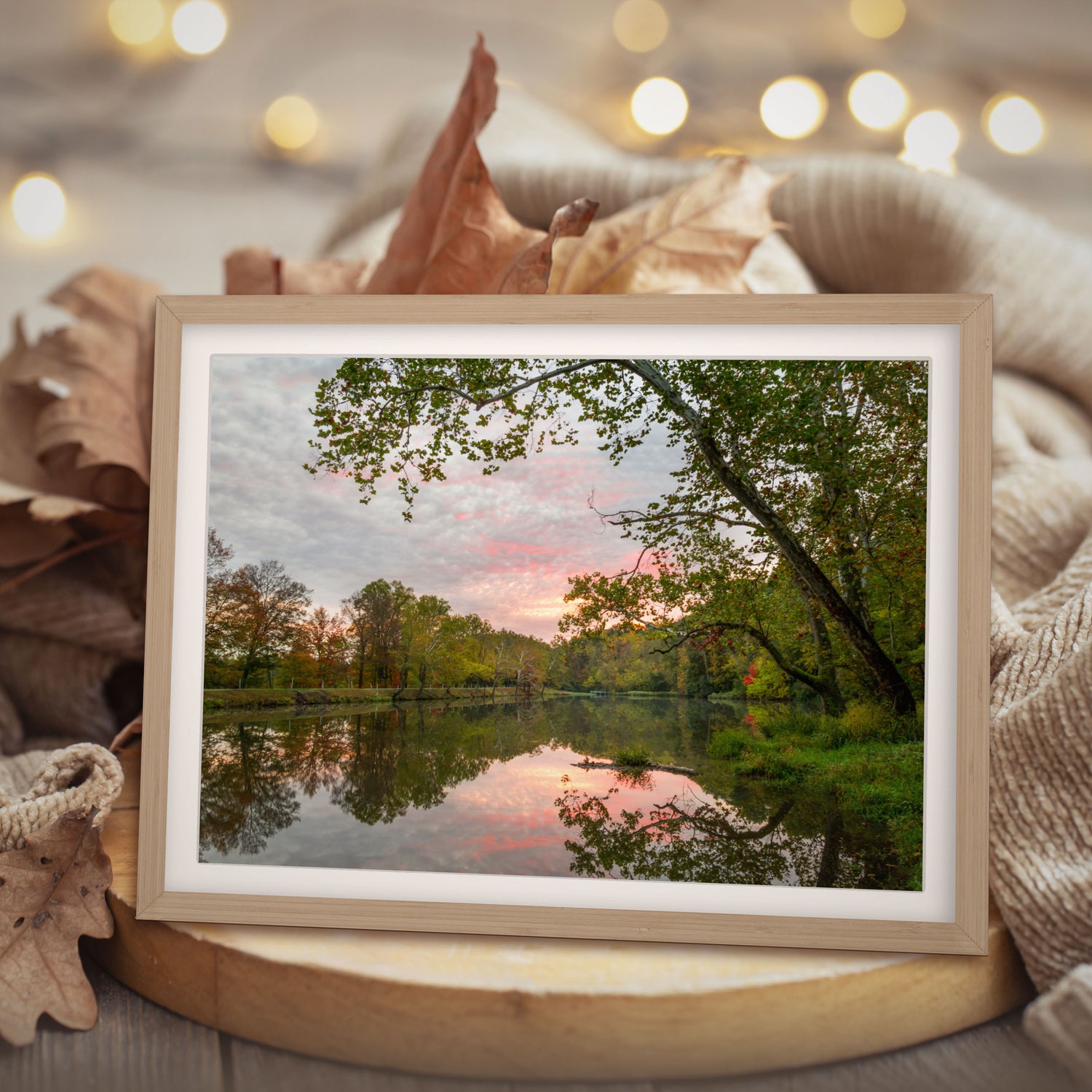 Elevate your master bedroom with this exquisite wall art, featuring a mesmerizing print of Tawawa Lake in Ohio during a pink and blue sunrise.