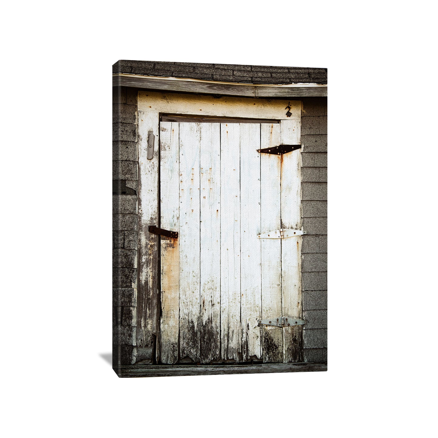 Canvas print capturing the rustic allure of a weathered shack door, symbolizing the beauty in the passing of time, showcased on a 3/4" deep canvas.