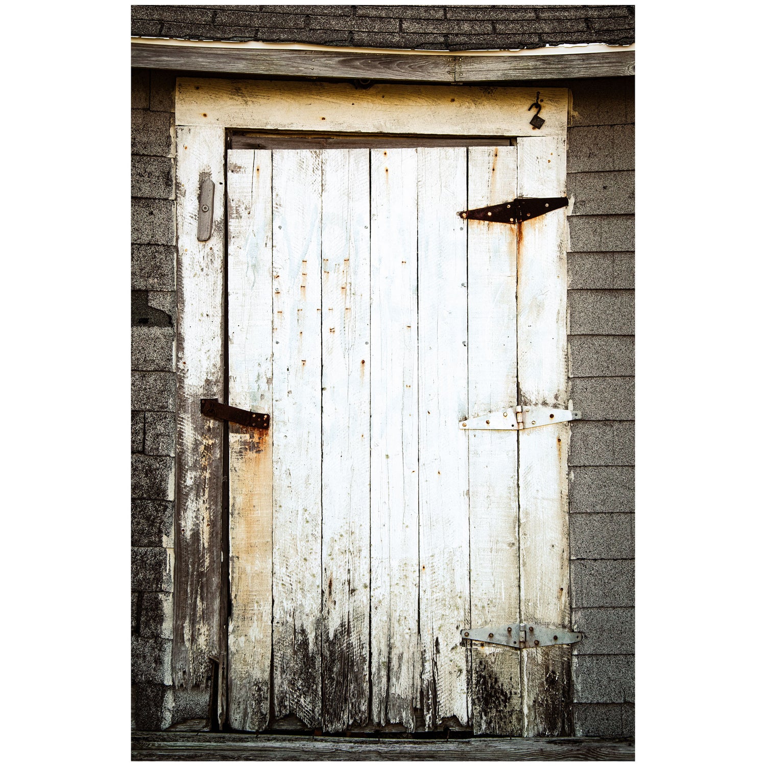 Timeless wall art capturing the allure of a rustic door, inviting you to a forgotten corner of history and adding a unique and thought-provoking element to your environment.