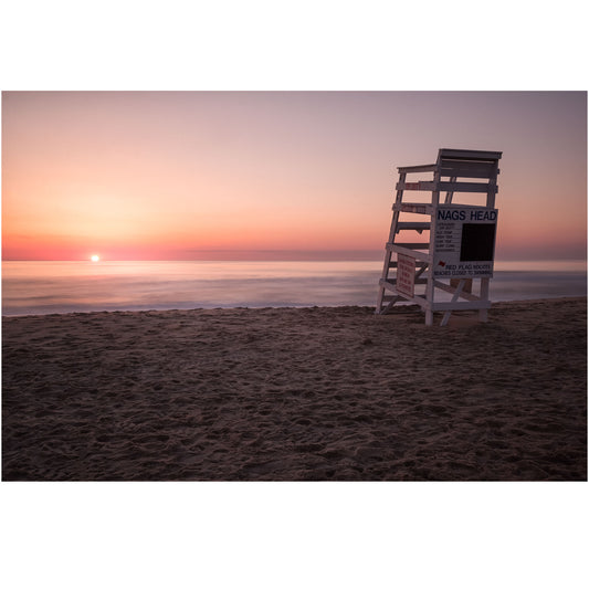 nags head beach lifeguard chair at sunrise