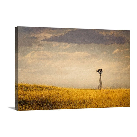 This canvas wall art invites the timeless Western landscape into your home, featuring a stoic windmill set against Nebraska’s sprawling golden fields.
