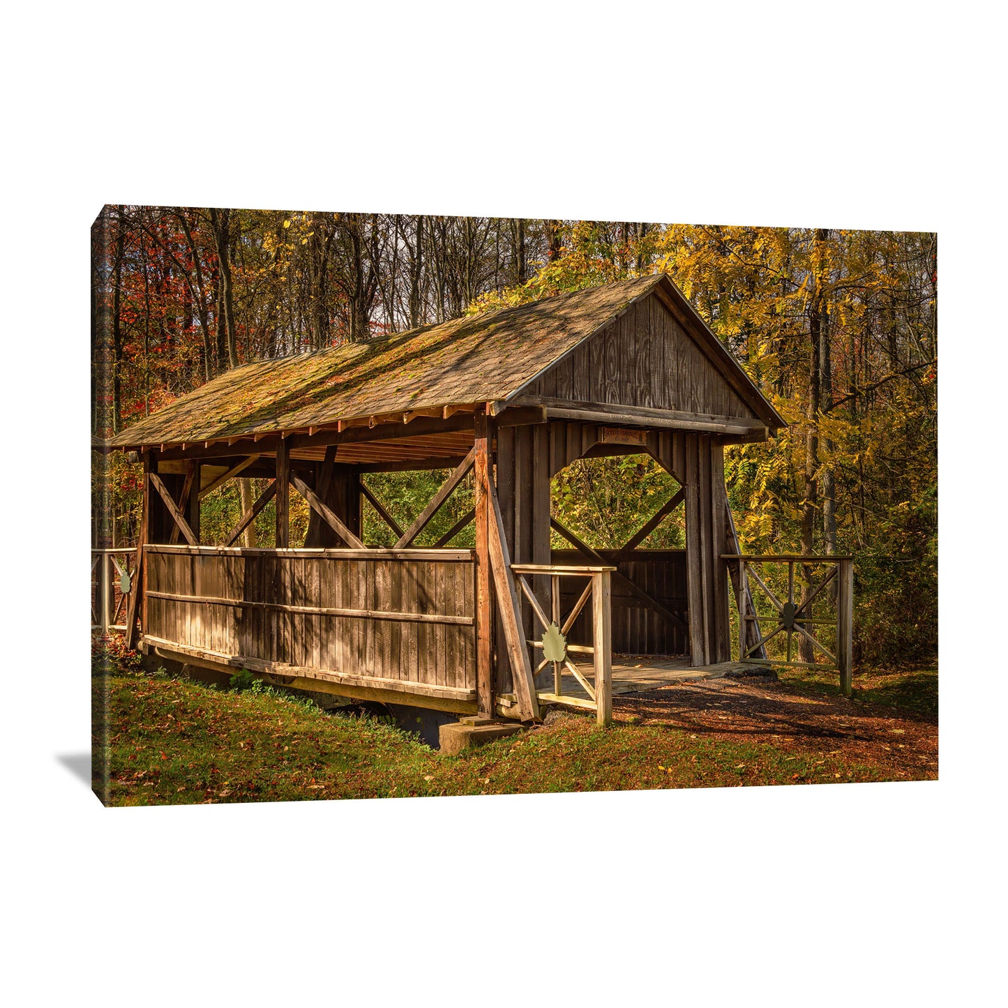 canvas wall art featuring a covered bridge in the edge of the fall forest