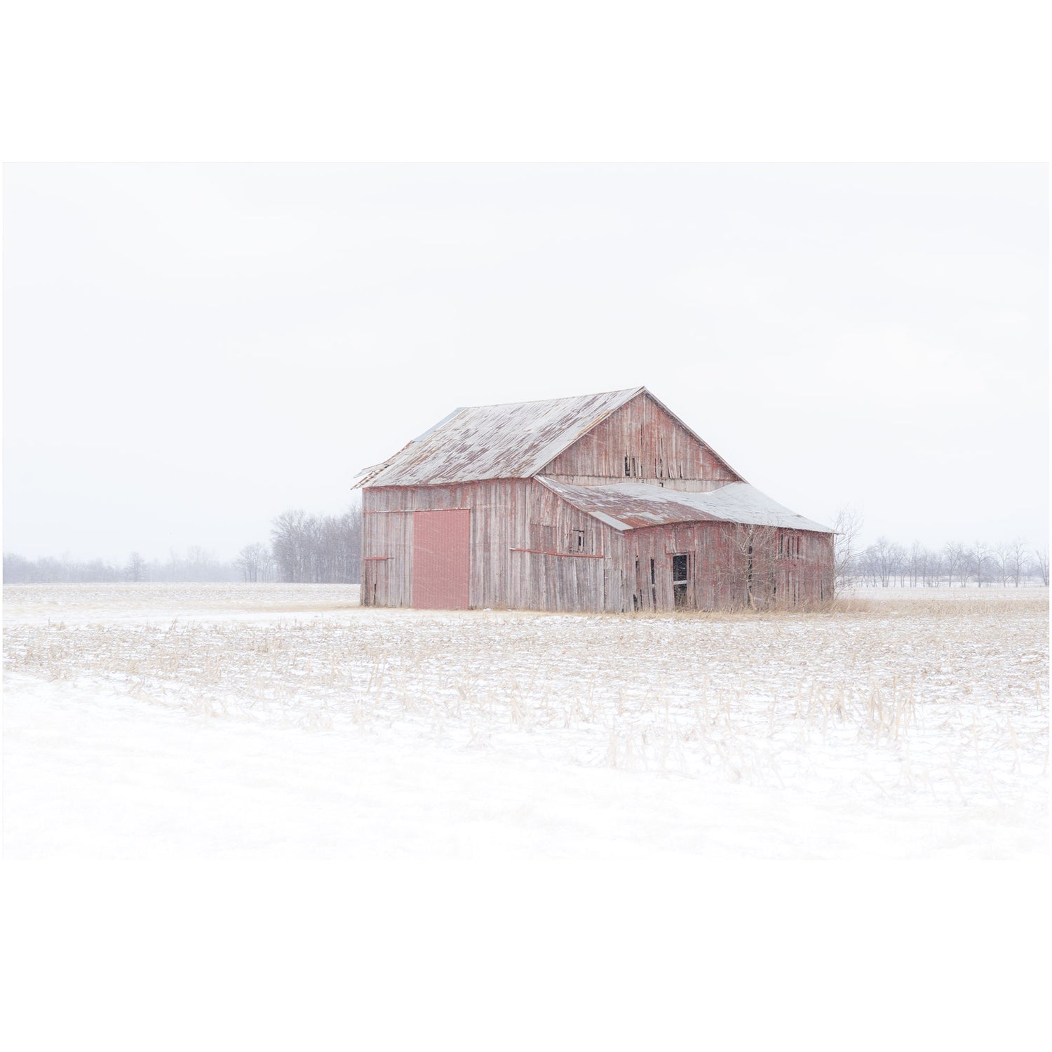red barn in the a winter snow storm photography